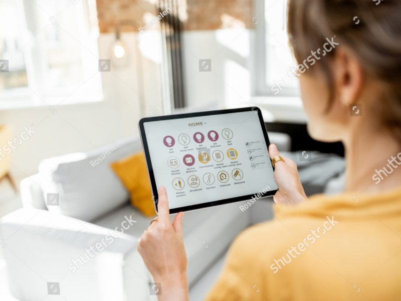 A LAdy looking at stats on a tablet